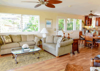 Spacious living room at Bayview Retreats with modern coastal decor and bay views